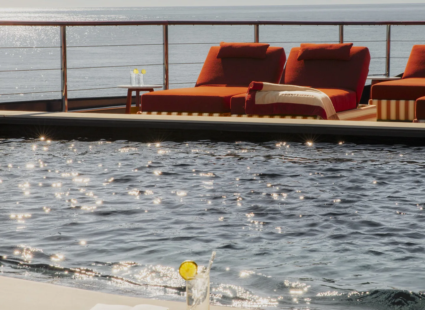The outdoor pool on Orient Express Corinthian with the sea beyond