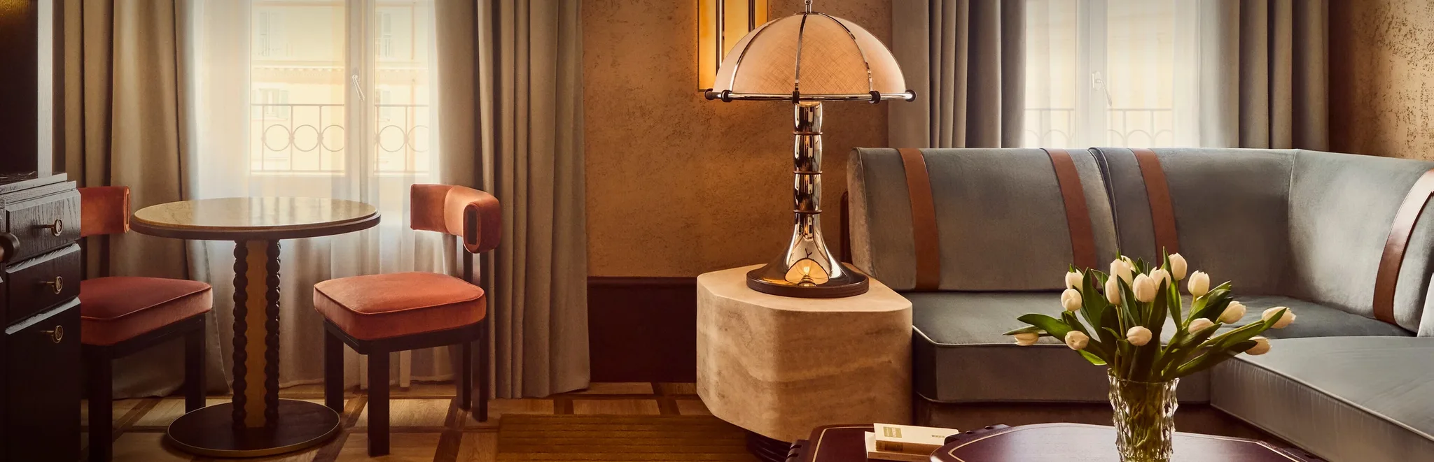 Orient Express Hotels - Luxury lounge and suite interior with warm ambient lamp lighting