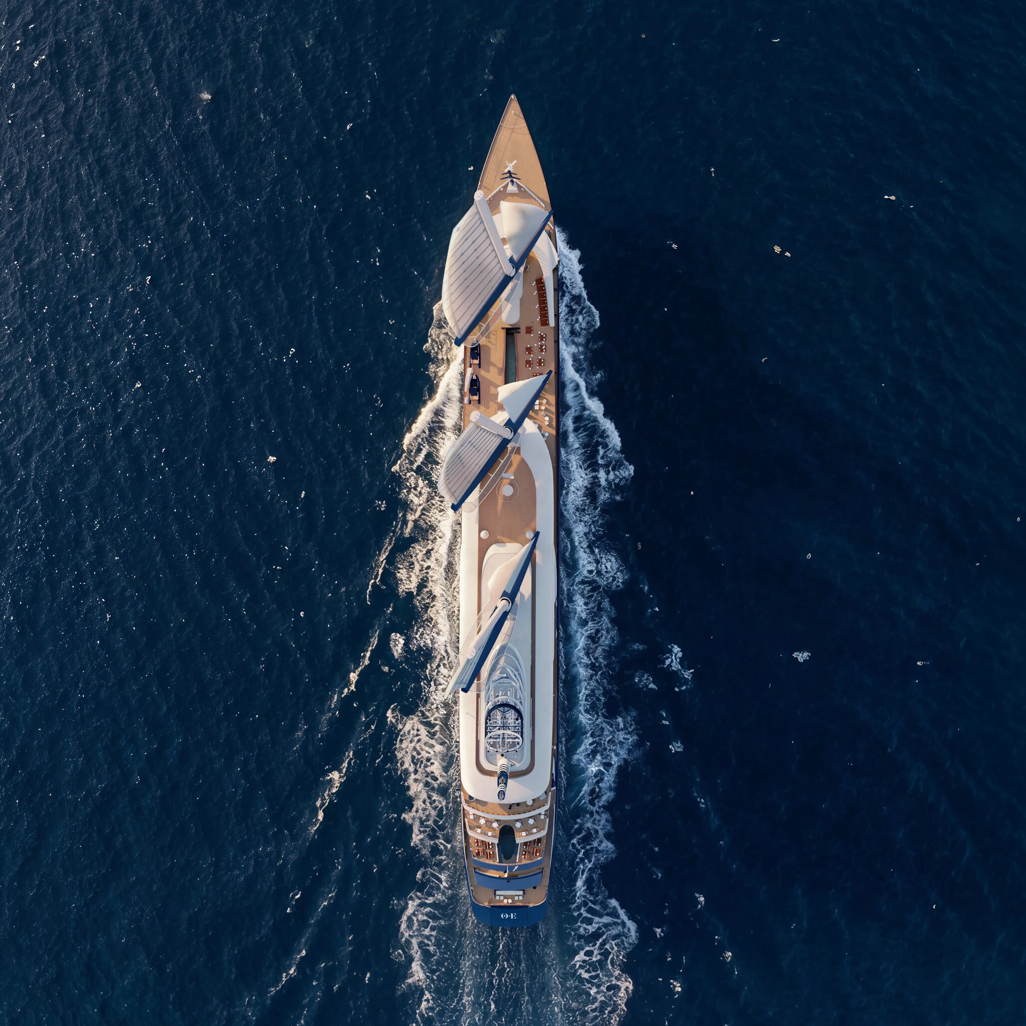 Aerial view of a sailing yacht with 3 sails