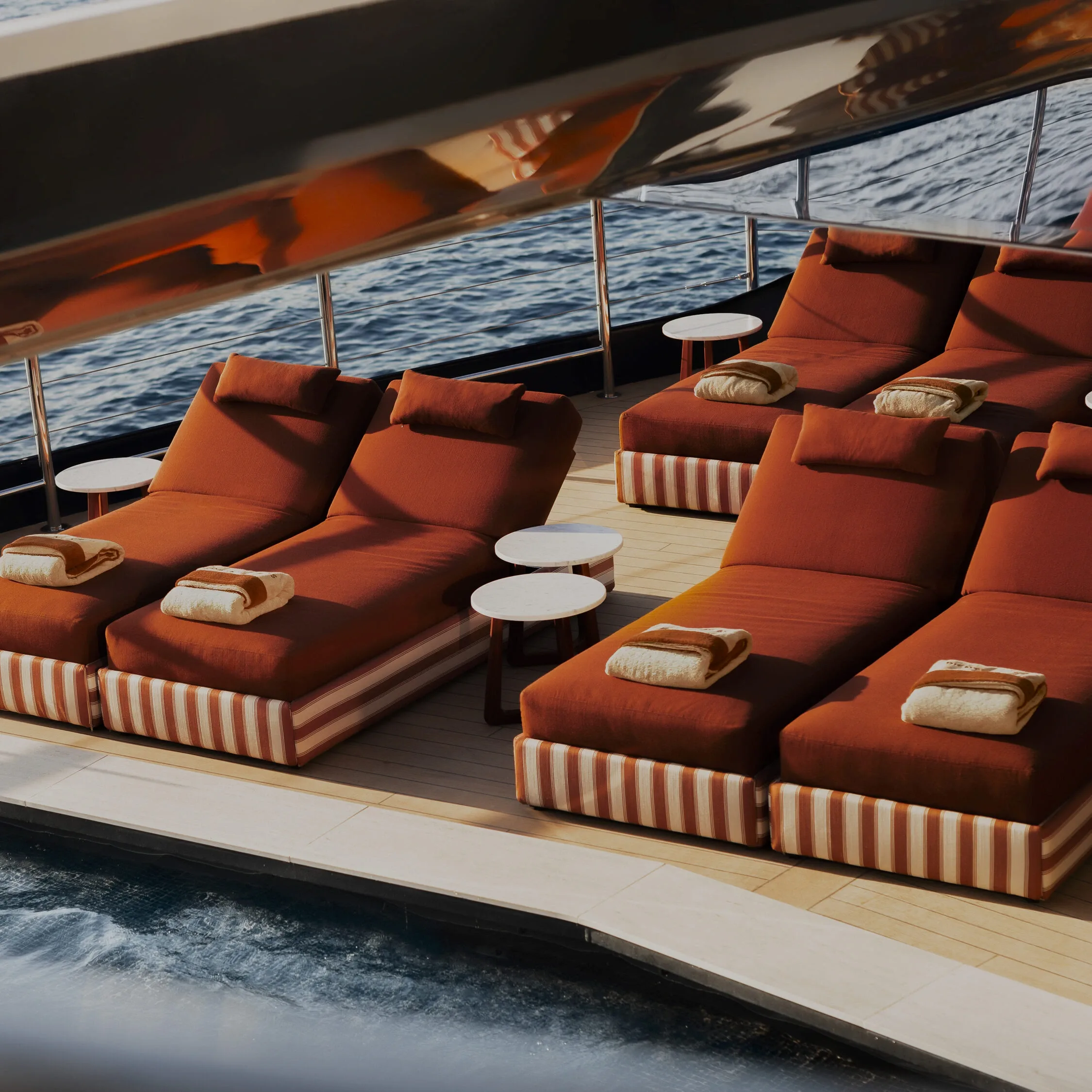 Sunbeds and pool with sea view
